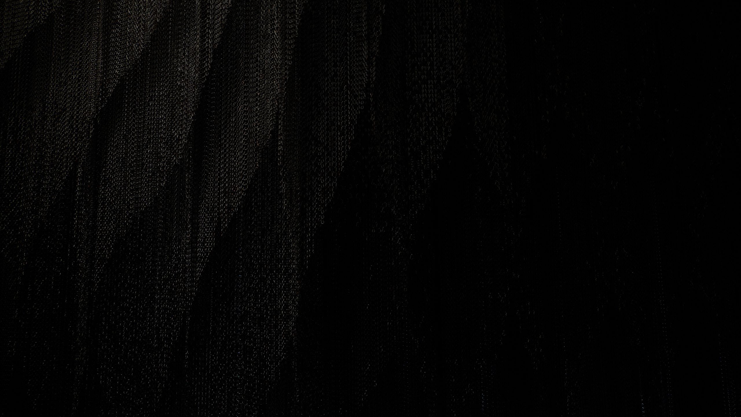 Sheets of dark chain hanging down. Photo: Carl Bergstrom