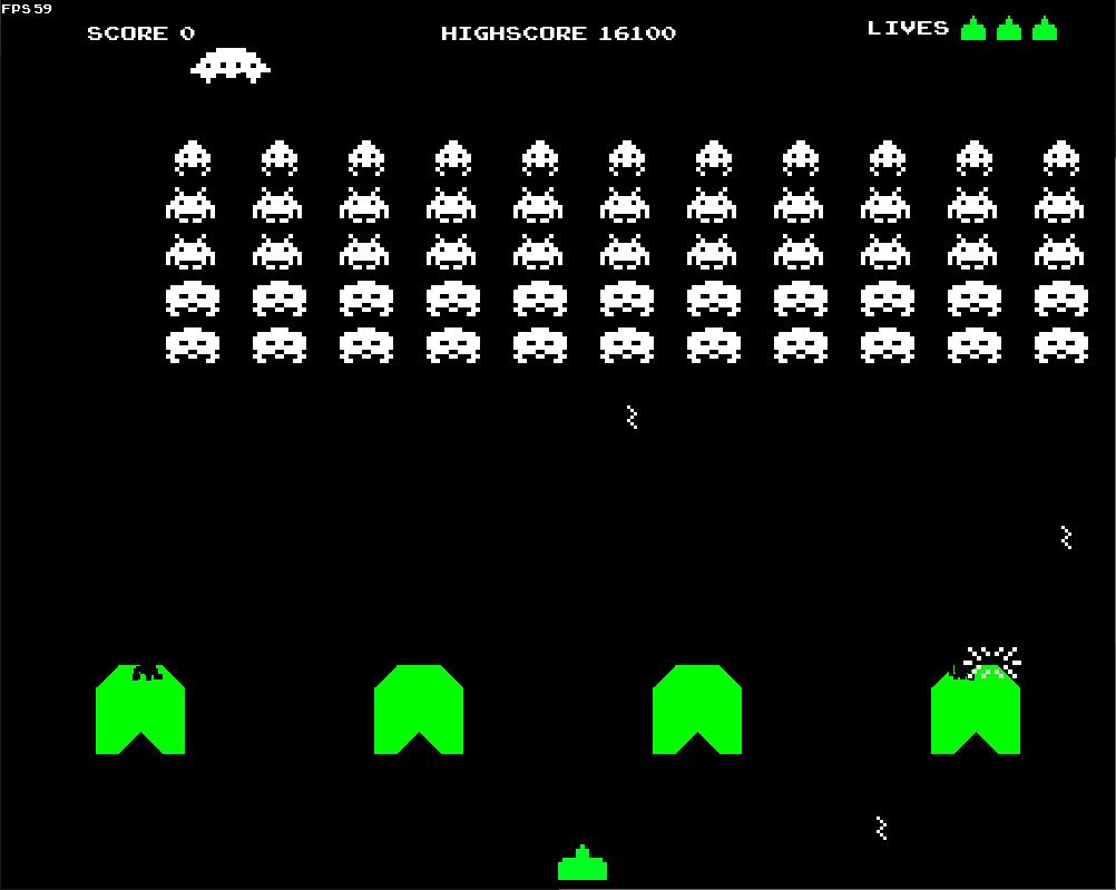 Screen capture from Atari's original space invaders arcade game. White "aliens" loom at the top of the screen while the player's ship and shields are in green at the bottom.