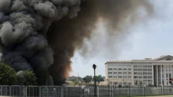 Dark smoke rises adjacent to the Pentagon in a computer-generated fake image.